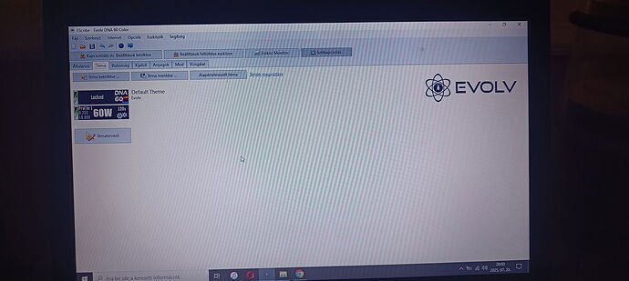 A laptop screen is visible, showing the Evolv software interface, with the text "DNA 60W" on the left side. (Captioned by AI)