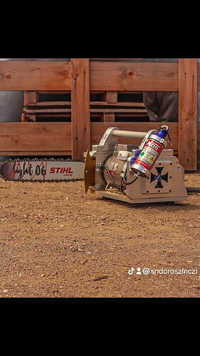 A special, custom-made chainsaw machine with a NOS nitrous oxide bottle visible, on an earthy floor area, in front of a wooden fence. (Subtitled with AI)