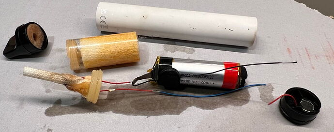 People walking out of a large, multi-story, light-colored modern building onto the sidewalk. There is also an escalator in front of them. (AI-generated caption)