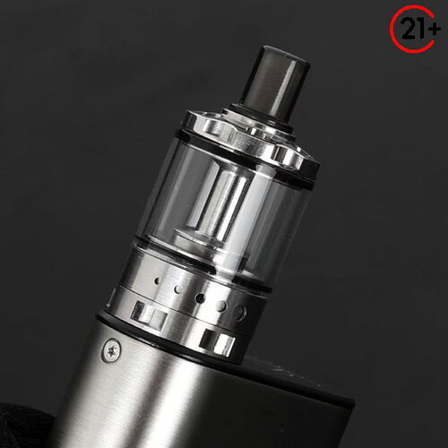 This image depicts a metal electronic cigarette (vape) against a dark background, with a 21+ age restriction pictogram visible in the upper right corner. (Labeled with AI)