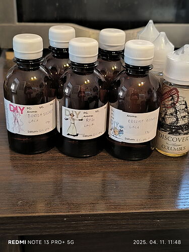 This image depicts several bottles of dark liquid with different labels, placed on a table. (Labeled by AI)