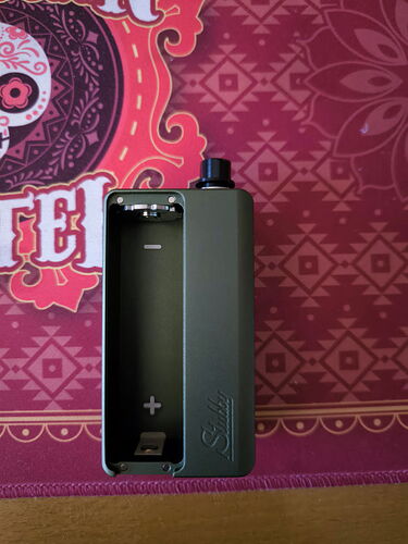 A green vape device is shown in the image, with space available for the battery. (Autogenerated by AI)