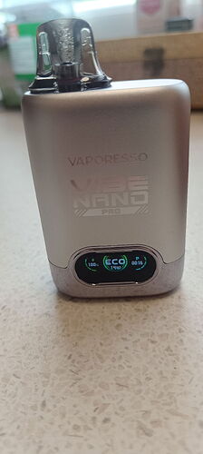 This image depicts a Vaporesso Vibe Nano Pro e-cigarette, showing a digital display. (Labeled by AI)