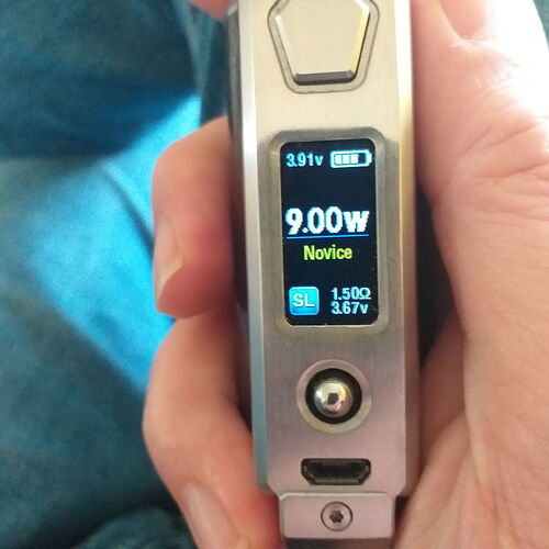 A handheld electric device with a digital display, showing 9.00 watts of power and other technical data. (Labeled by AI)