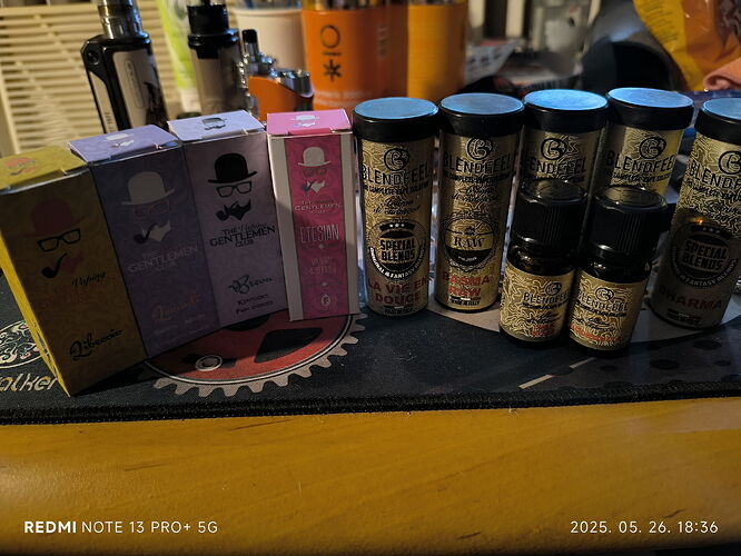 Various fragrances and perfumes are lined up next to each other on the table. (Labeled by AI)