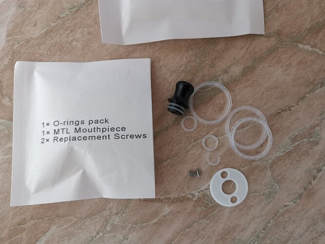 Innokin Ares Finale - Paper Bag Contents (seals, screws, drip tip)
