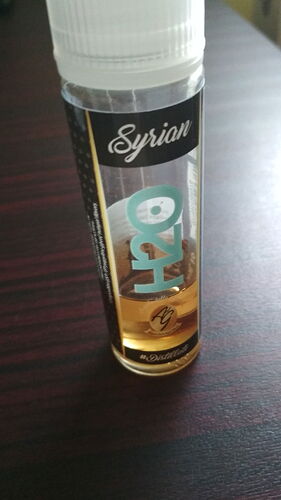 A clear liquid is in the bottle, with the label saying "Syrian H20". (Labeled by AI)