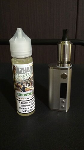 A bottle of e-liquid and a vaporizer, used as an alternative to smoking, are shown in the picture. (AI-generated caption)