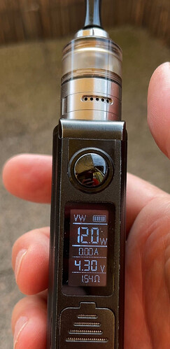 A hand holding a black e-cigarette with data visible on its digital display. (AI-generated caption)